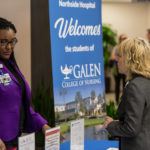 people standing around chatting