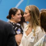 people standing around chatting