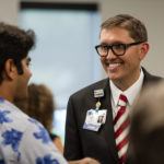 people standing around chatting